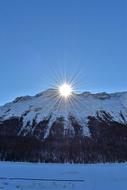 sun in the winter mountains