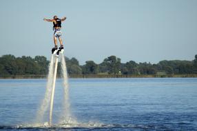 athlete on flyboard at sea