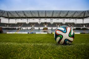 Ball on pitch in soccer stadium