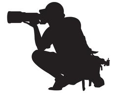 black silhouette of a sports photographer