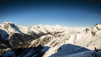 scenic snowy Mountains beneath blue sky, italy, South Tyrol, Klausberg