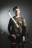 photo of an archer on a dark background