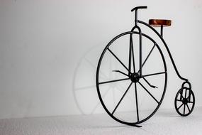 photo of a retro bicycle with a large front wheel