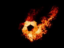 fire and soccer ball on a black background