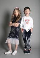 Boy and girl children, posing in colorful clothing