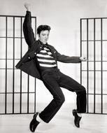 black and white photo of dancing Elvis Presley