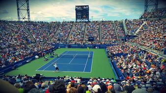 fans on tennis tournament on stadium