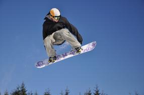 snowboarder makes a high jump