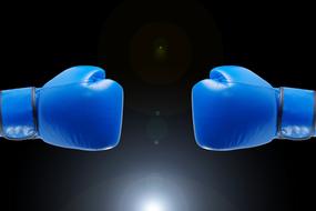 Shiny, blue boxing gloves, at black background, with light, clipart