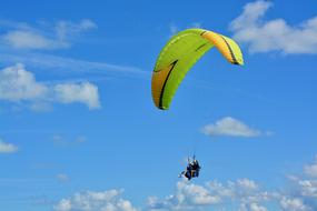 bi-place paraglider at sky