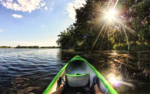 photo of the front of the canoe on the lake under the sun