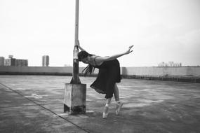 girl in Ballet shoes Dancing on roof