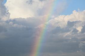 rainbow on a background of white clouds