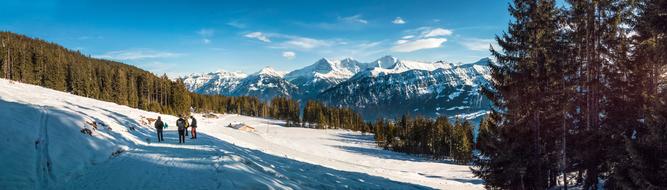 tourists in the winter mountains