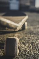 Beautiful skateboard with wheels, on the asphalt in light