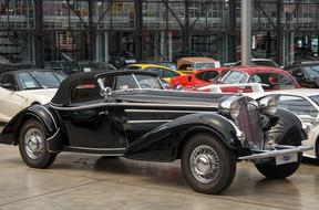 vintage designer cars on display