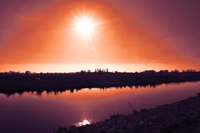 colorful sunset reflected on the surface of a reservoir in Amstelveen, Netherlands