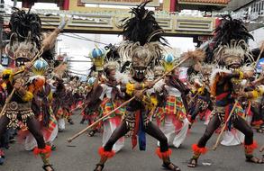 People in colorful costumes, dancing on the beautiful parade