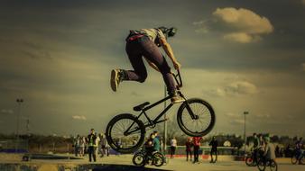 cyclist jumping in city park