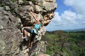 girl Climbing rock in wilderness