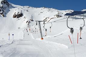Ski Lift along trace in scenic snow-capped mountains
