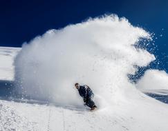downhill skiing on a snowboard