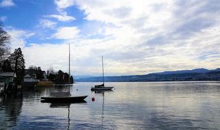 boats on the lake in Kusnacht at dusk