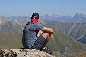 hiker on the the mountain top on a sunny day