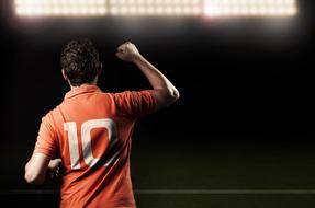 soccer player on the background of spotlights in the stadium