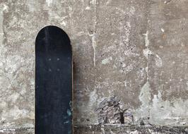 black skate stands at the front wall