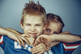 photo of brother and sister hugging