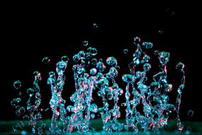 water droplets rising up on a black background