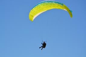 parachutist flies over Normandy, France