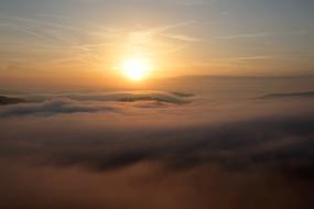 rising sun above the clouds