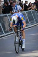 tired cycling racer at the finish