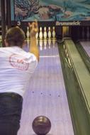 sporty man playing bowling