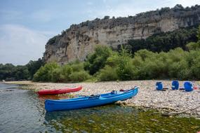 moored blue and red canoes