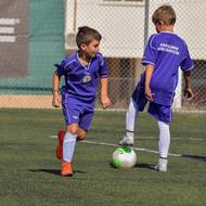 exercising young football players