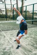 Man doing exercises on Tennis court