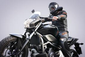 sitting motorcyclist