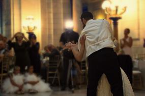 photo of dancing couple on wedding party