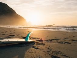 surf board lies on the beach