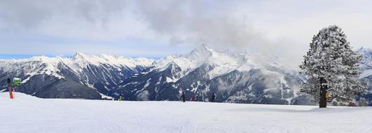 tourists in winter mountain panorama