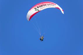 paraglider in the blue sky