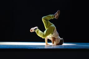 young man is dancing hiphop on stage