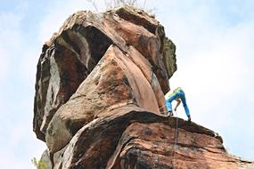 brave climber on a stone wall