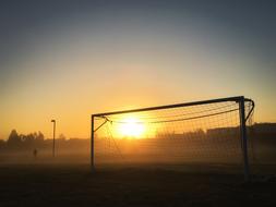 goal on the football field at dawn