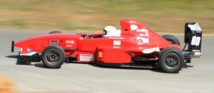 red race car on the highway