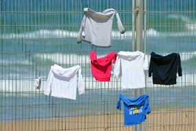 Sport T-Shirts on fence