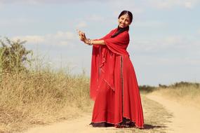 female indian dance in nature on a sunny day